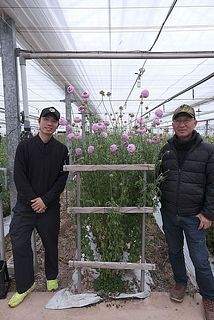 寺尾さんと息子の恭平さん。