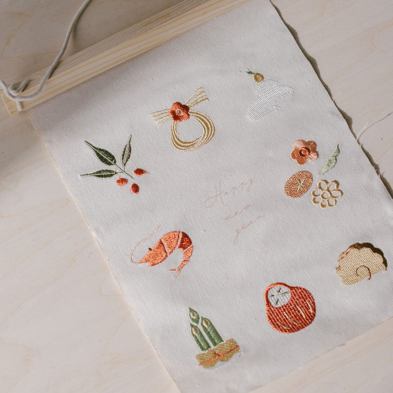 お正月の刺繍ミニタペストリー「おせち」